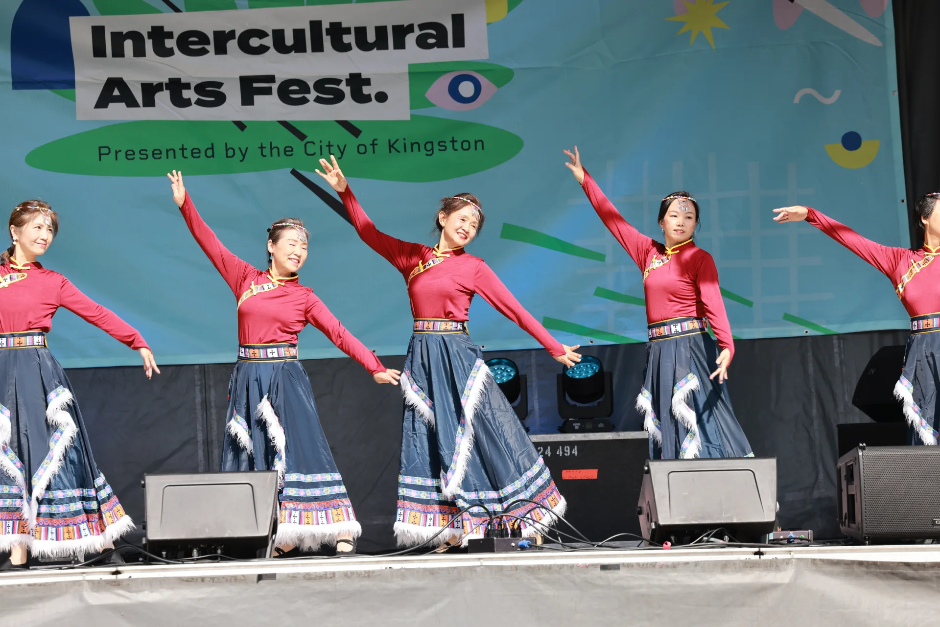 CCAKD folk dance group performing on stage at the Kingston Intercultural Arts Festival